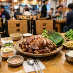 jokbal name meaning Korean restaurant table with jokbal and side dishes